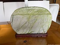 Front view of stone on stand with ruler showing width and height