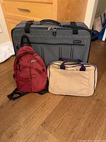 All three bags standing together for scale and overview