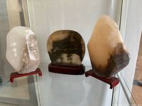 Front view of all three stones on stands