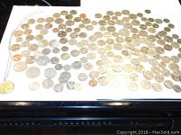 Full layout of all coins and the necklace displayed on a white surface