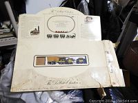 Top view of original box showing train set inside with locomotive and passenger cars visible through window