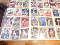 Close-up photo of one sheet with individual baseball cards showing players from various MLB teams including the Yankees and Pirates.