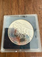 Reverse: four-horse stagecoach design with CANADA 1992 DOLLAR legend