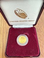 Coin in capsule inside open burgundy U.S. Mint case