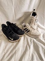 Both pairs of sneakers side by side