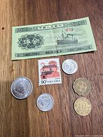 Overall view showing banknote, stamp and all five coins