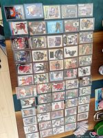 Wide view of all hockey cards laid out on table in protective holders