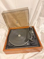 Top view of Dual 1210 turntable with dust cover open