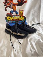 Pair of Adidas Yeezy Boost 350 V2 sneakers front and side view