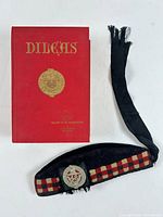 Book and glengarry cap overview