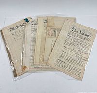 Group view of seven folded legal documents