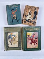 Front covers of all four books showing titles and decorated bindings