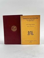 Front view of both books: burgundy hardcover and yellow softcover