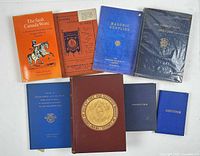 Group shot of all eight volumes showing covers and colours