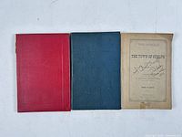 Front covers of all three volumes: red cloth St. George’s Parish, blue cloth Annals, tan softcover Annals