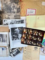 Overview of assorted photographs, clippings, pamphlets and documents