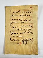 Recto of first leaf with musical notation, text and knotwork initial