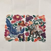 Full view of multicoloured stone rubbing on folded rice paper