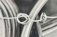 Close view of image detail showing twisted cable subject