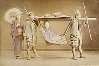 Close view of hand-coloured photograph showing kago sedan chair scene