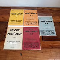 All five Funny Money comic books laid out face up