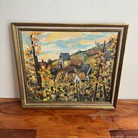 Front view of framed oil landscape painting