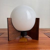 Lamp unlit showing oak base and white globe