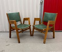 Front angled view of both chairs showing overall design and wear
