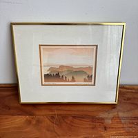 Front view of framed print with title and signature visible