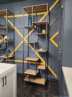 Full view of tall iron and pine bookcase