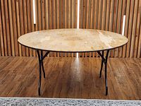 Full view of round table with legs extended