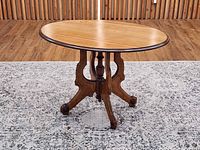 Three-quarter view showing full table and base