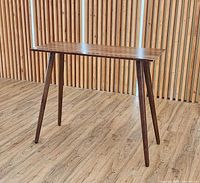 Full view of walnut bar table front angle