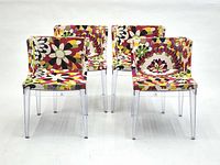 Set of four floral Kartell style chairs
