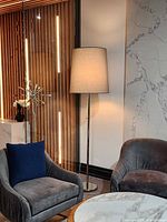 Floor lamp beside chairs showing overall appearance