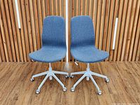 Front view of both chairs showing upholstery and bases