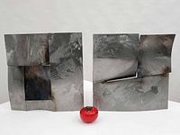 Both Todd Richter cut steel wall sculptures side by side with scale reference
