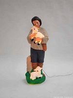 Front view of illuminated 34" stable boy blow mould with lambs and attached cord