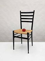 Full view of chair front right showing ladderback and rush seat