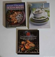 Front covers of three cookbooks showing titles and condition