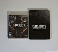 Front view showing Black Ops PS3 case and Modern Warfare Collection steelbook