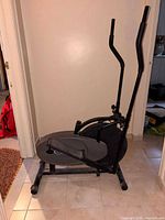 Full side view of Thane Fitness OrbiTrek elliptical showing overall structure