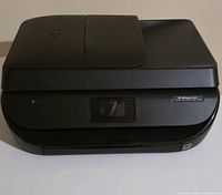 Front angled view showing HP OfficeJet 4650 printer body and touchscreen