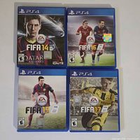 Front view of four PS4 FIFA game cases