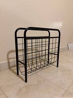 Front view of black metal magazine rack
