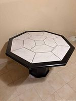Top view showing white tiled geometric pattern and black frame