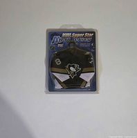 Front of sealed package showing micro jersey front with Penguins logo