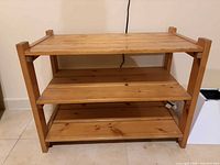 Front view showing three shelves and overall condition