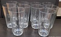 Front view of all ten clear fluted water glasses