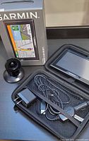 GPS unit, mount, carry case with cables, original box